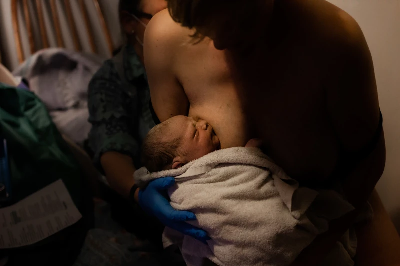 Woman holding her newborn baby 